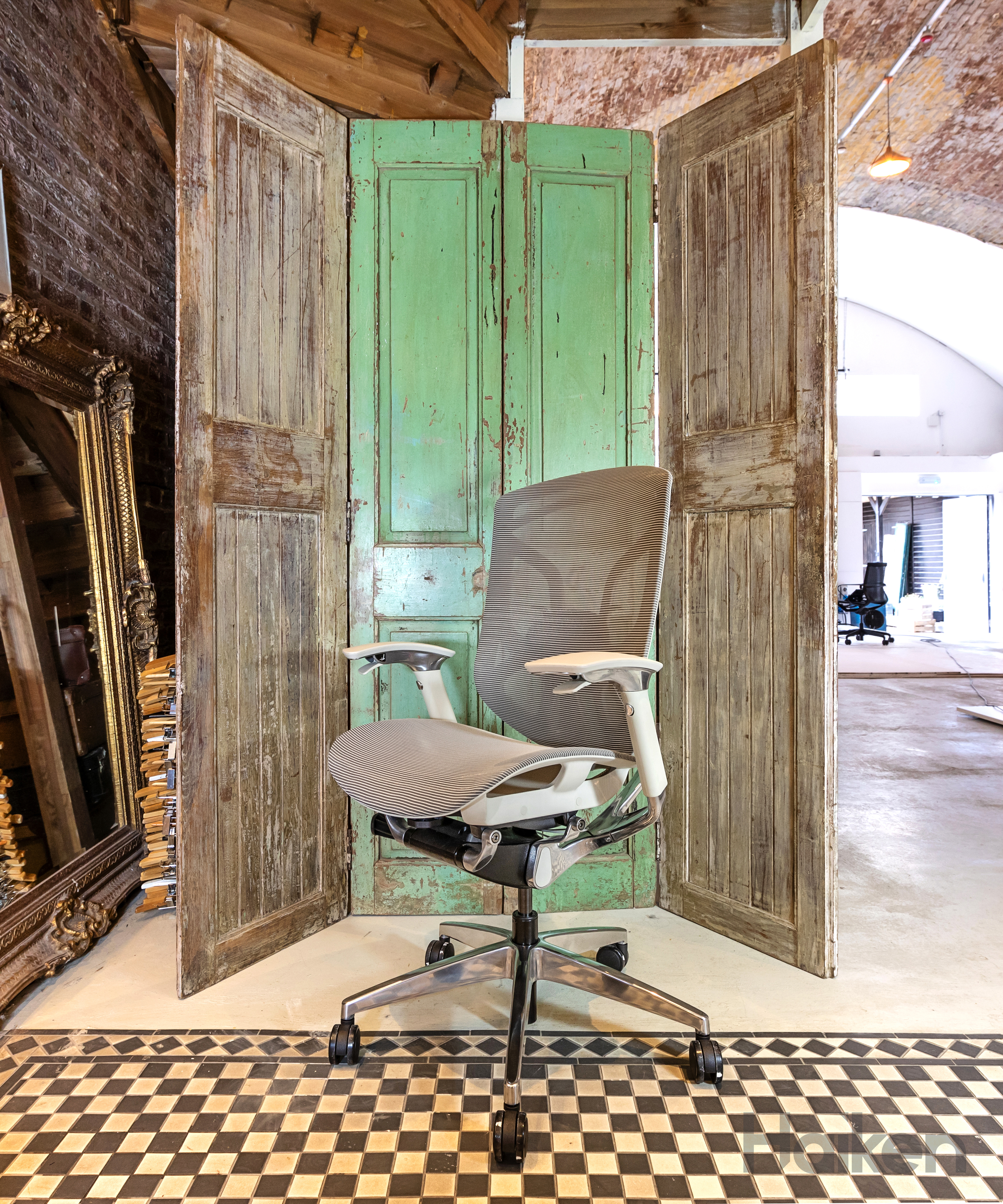 grey office task chair with doors behind